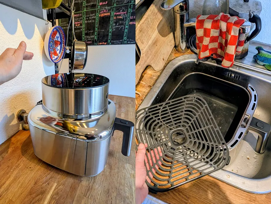 Die Abluft der Cosori Iconic Heißluftfritteuse wird mit der Hand auf Temperatur überprüft und daneben liegt die Schublade im Waschbecken.