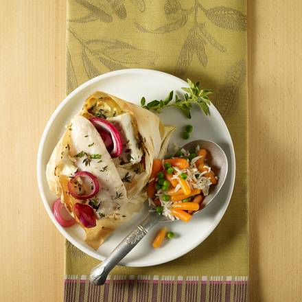 Feta-Fischpäckchen mit Gemüsereis Rezept Feta-Fischpäckchen mit Gemüsereis Rezept
