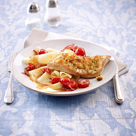 Putenschnitzel mit Macadamia-Rauke Haube und geschmorten Tomaten Rezept