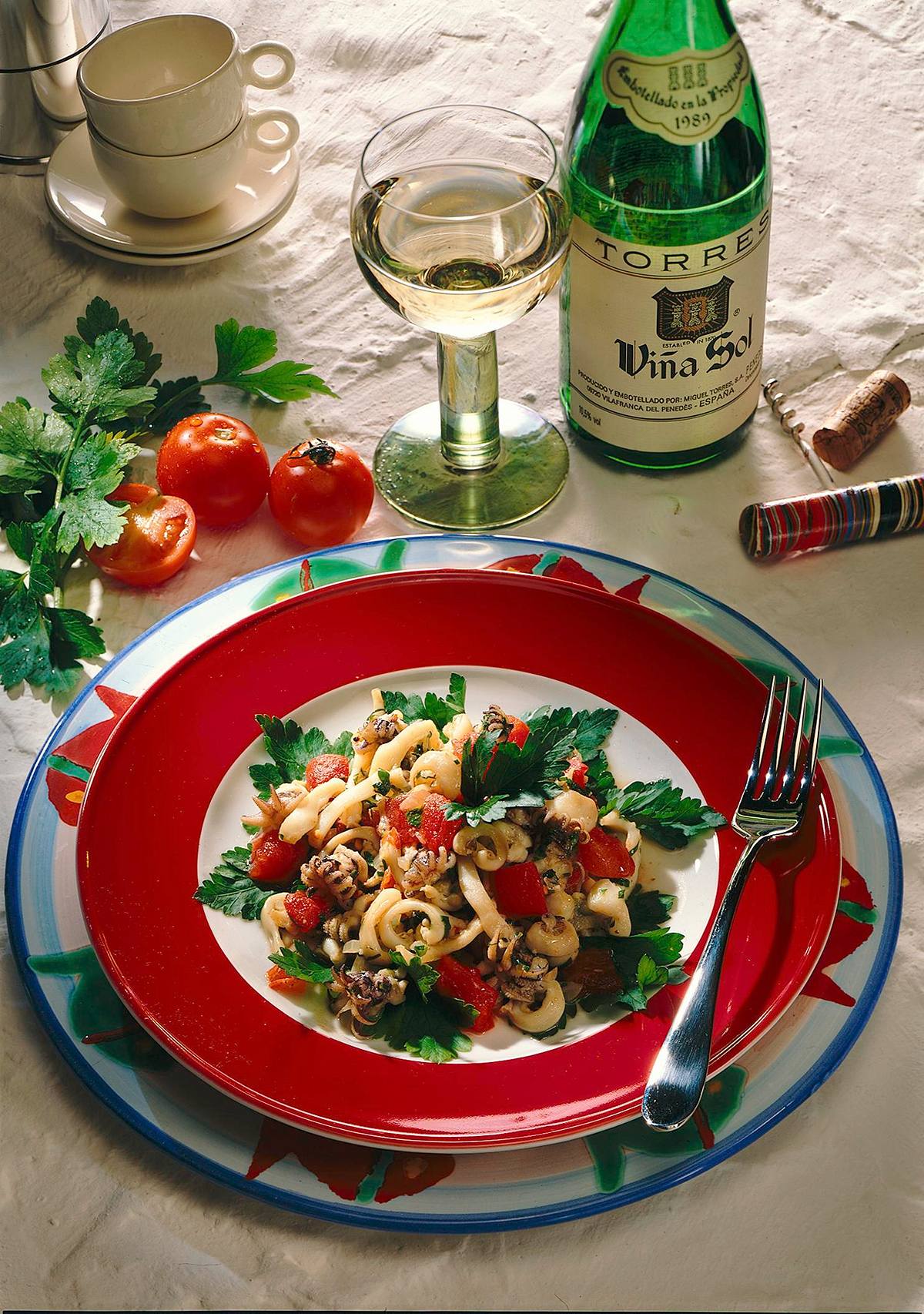 Tintenfische mit Zwiebeln und Tomaten Rezept